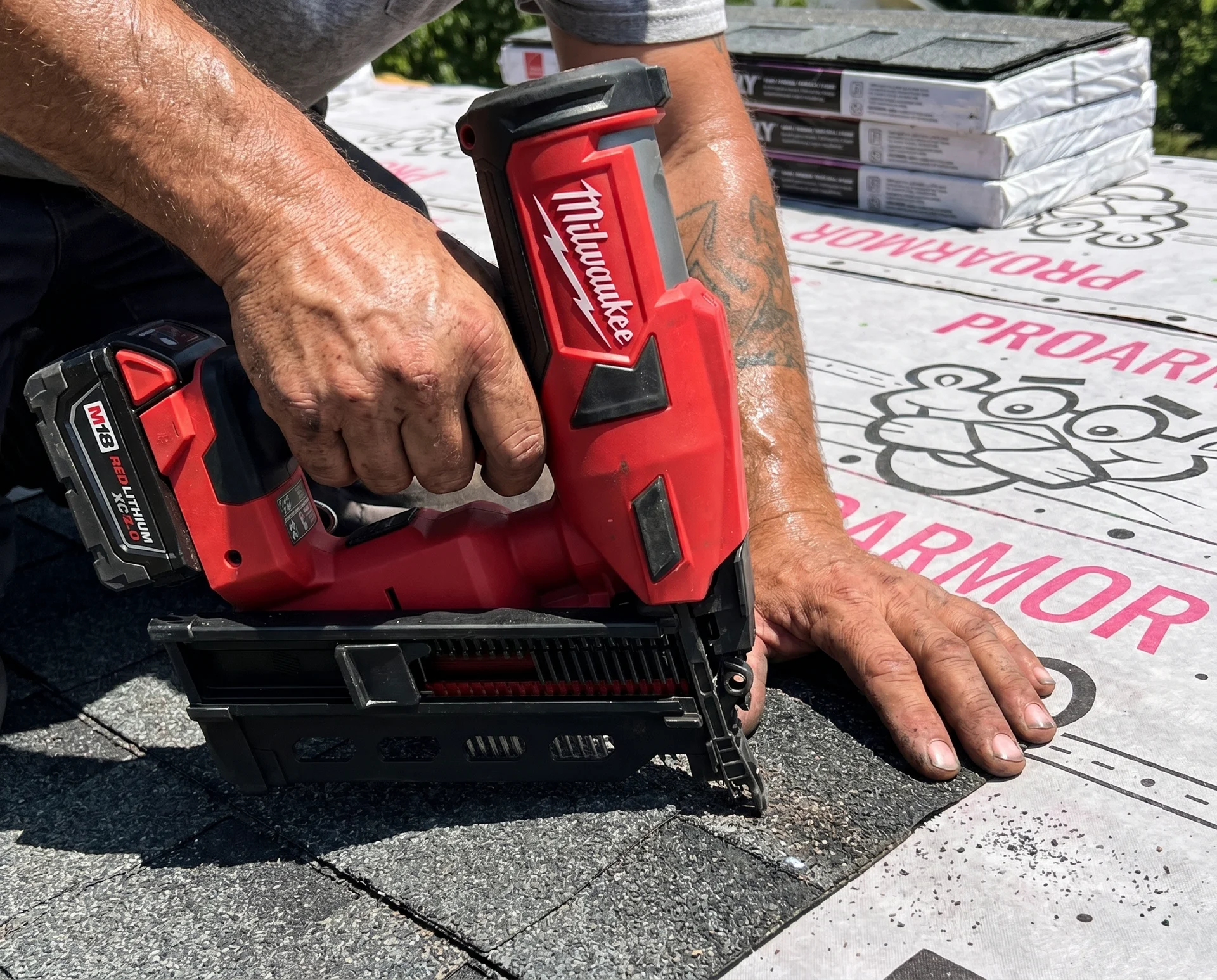 Crew installing new roof shingles